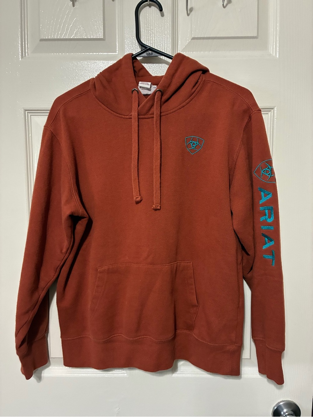 Ariat Rust Orange Crewneck Hoodie with Teal Logos